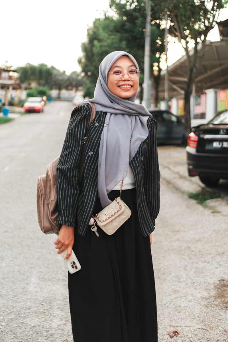 Woman wearing hijab and round glasses in casual professional style