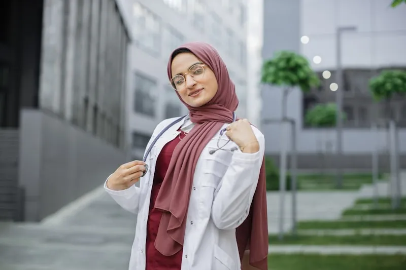 Professional woman wearing hijab and glasses with thin metal frames