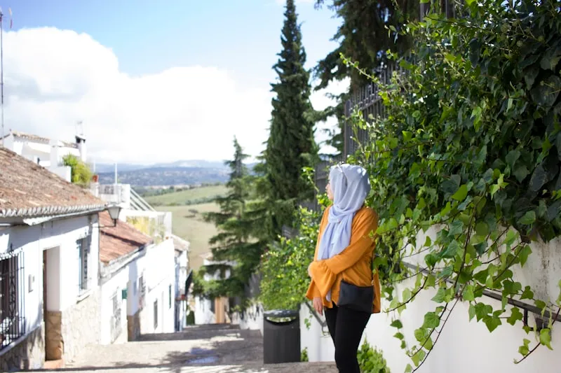 Woman in hijab traveling abroad, representing passport and travel documentation
